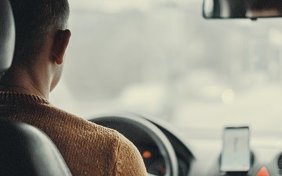 man driving car with gps 