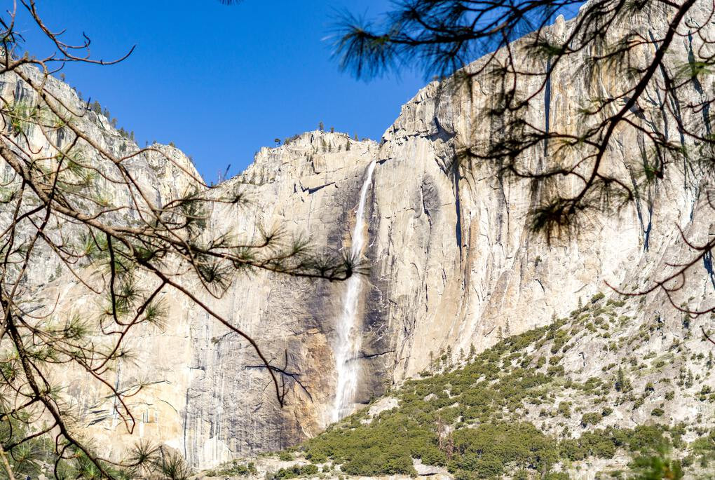 Cascading waterfall down a mountain in the Yosemite National Park